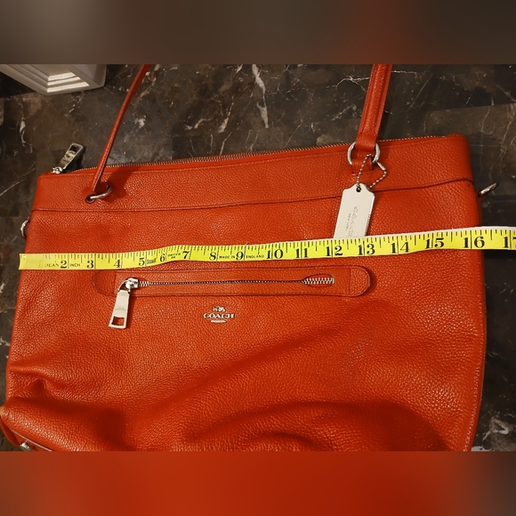 Coach Tyler Tote in an orange/red shade of pebbled leather. - Picture 9 of 16